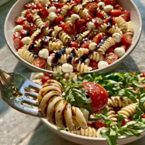Top-down view of Bruschetta Pasta Salad with glistening olive oil and fresh basil ribbons.